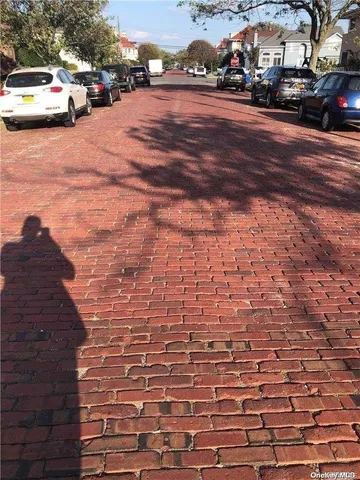 a view of street with parked cars