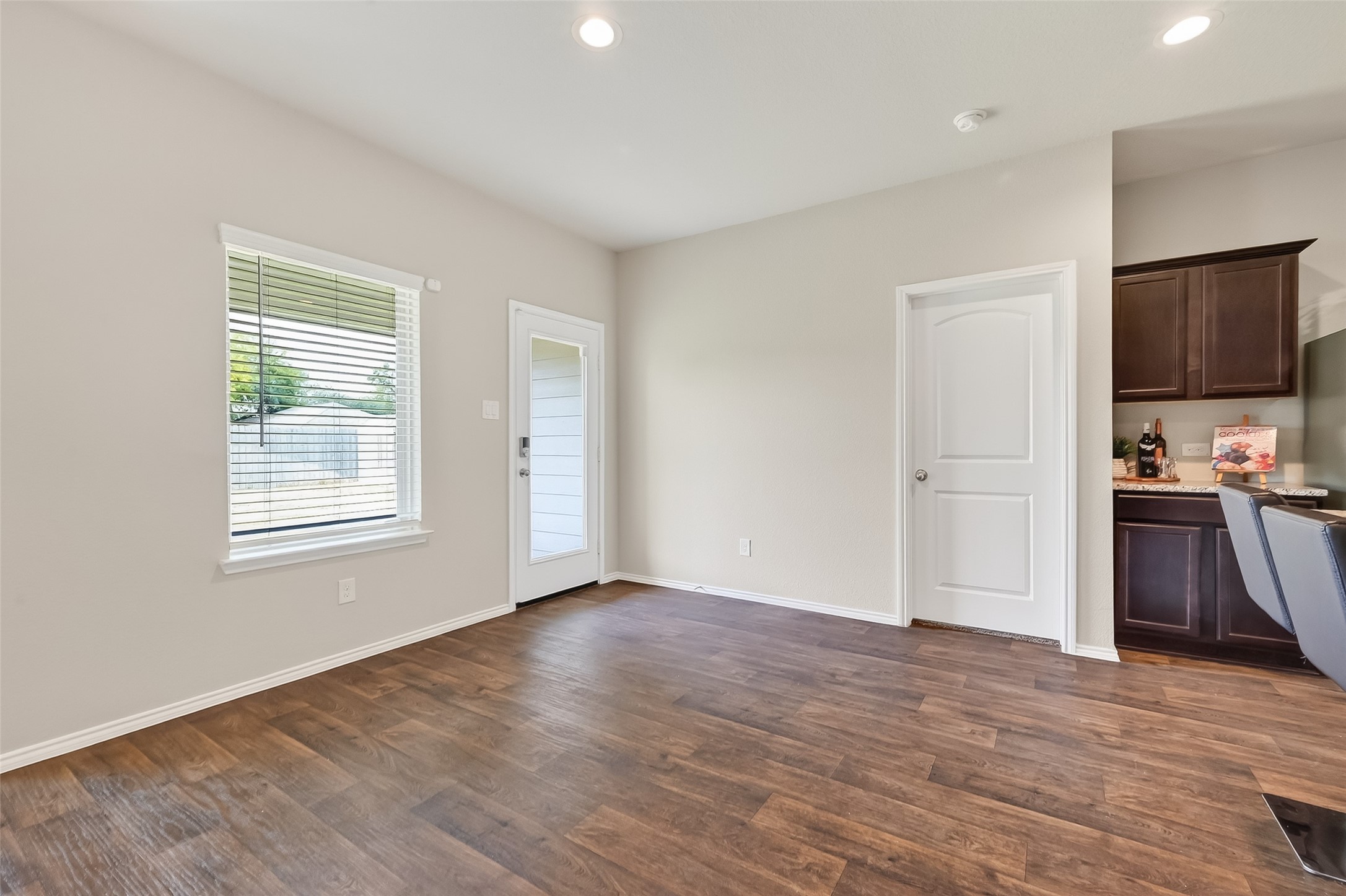 23511 Treeline Bluff Trail Spring Spring, TX 77373 - Photo 11 of 41 a view of empty room with kitchen and window