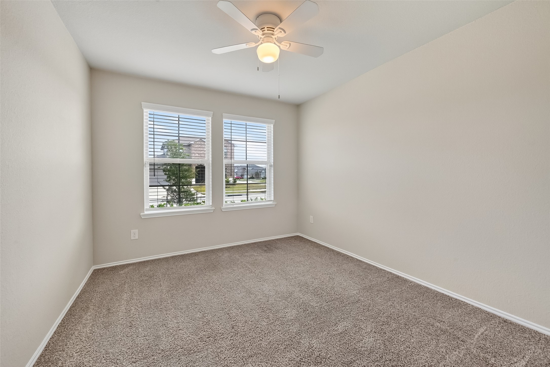 23511 Treeline Bluff Trail Spring Spring, TX 77373 - Photo 18 of 41 an empty room with a window and a fan