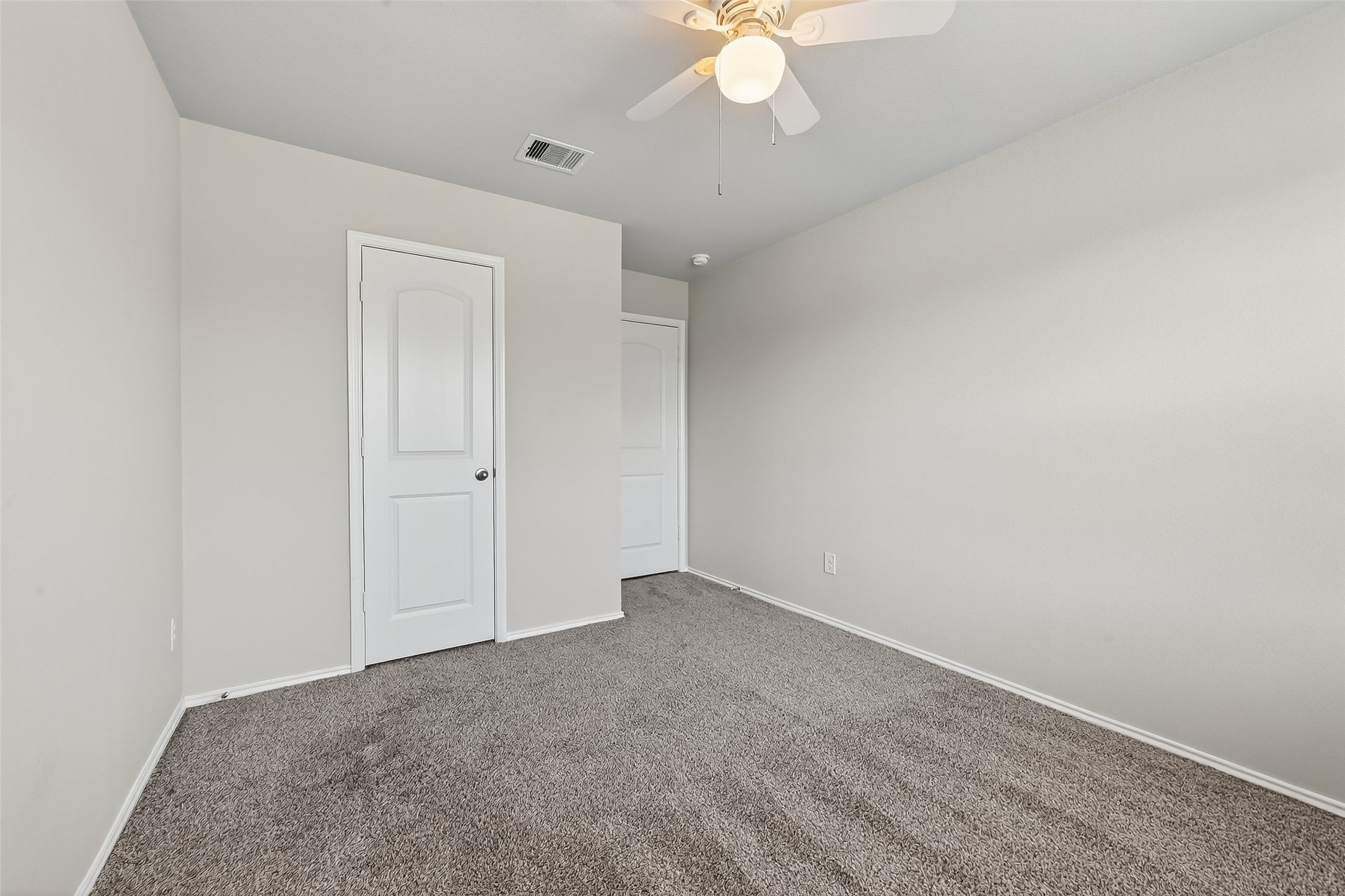 23511 Treeline Bluff Trail Spring Spring, TX 77373 - Photo 19 of 41 an empty room with a chandelier fan