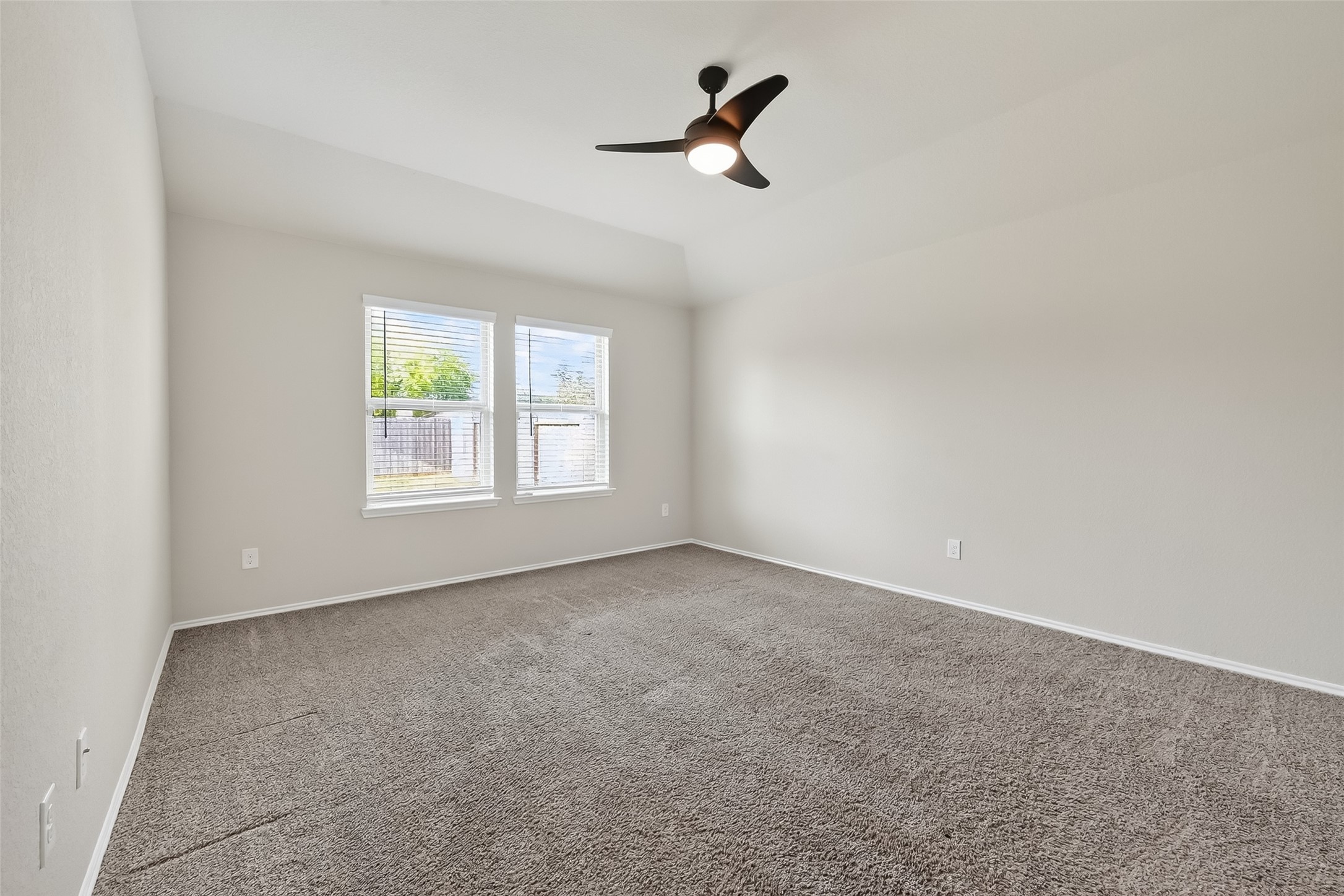 23511 Treeline Bluff Trail Spring Spring, TX 77373 - Photo 26 of 41 an empty room with windows and fan