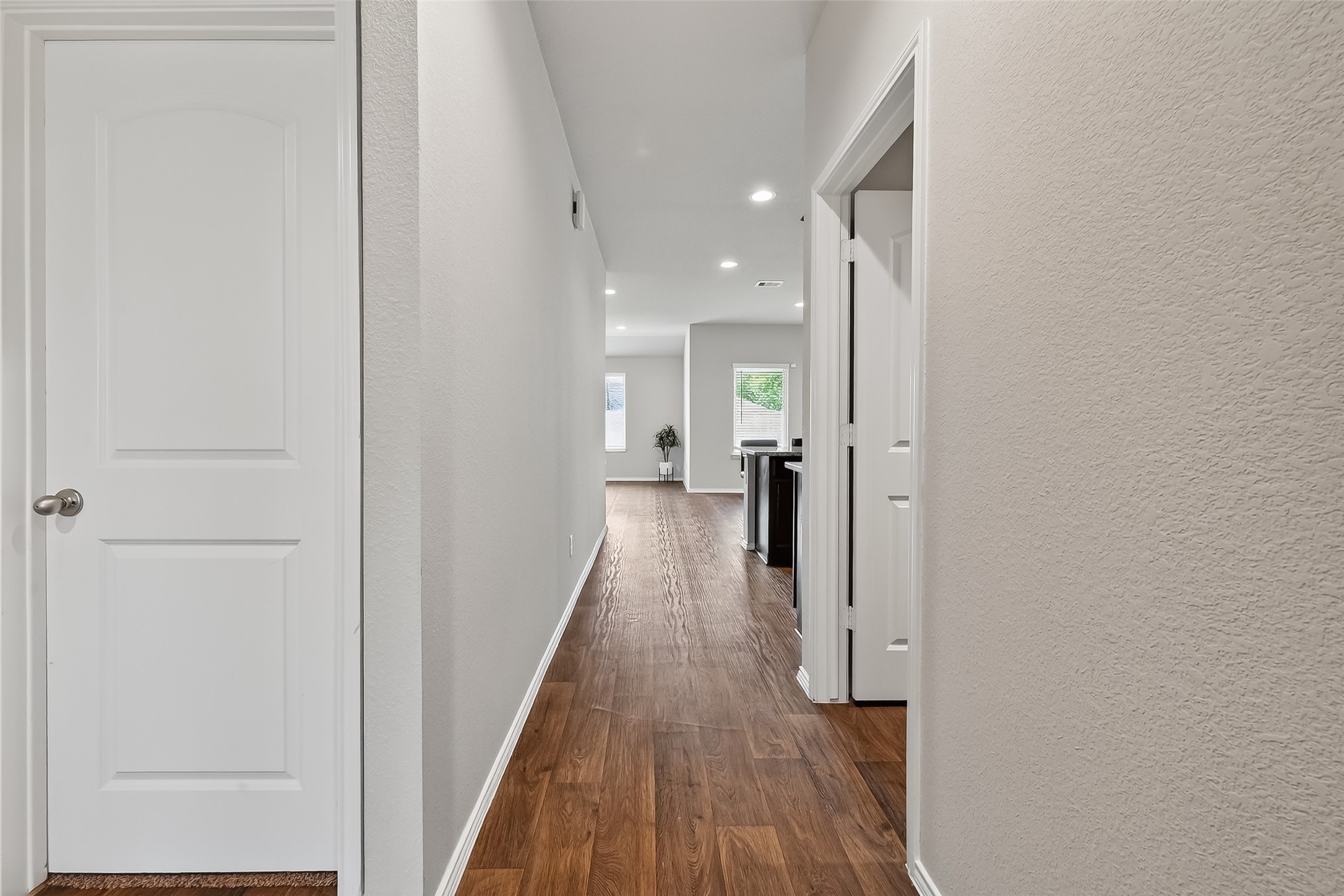 23511 Treeline Bluff Trail Spring Spring, TX 77373 - Photo 6 of 41 a view of a hallway with wooden floor