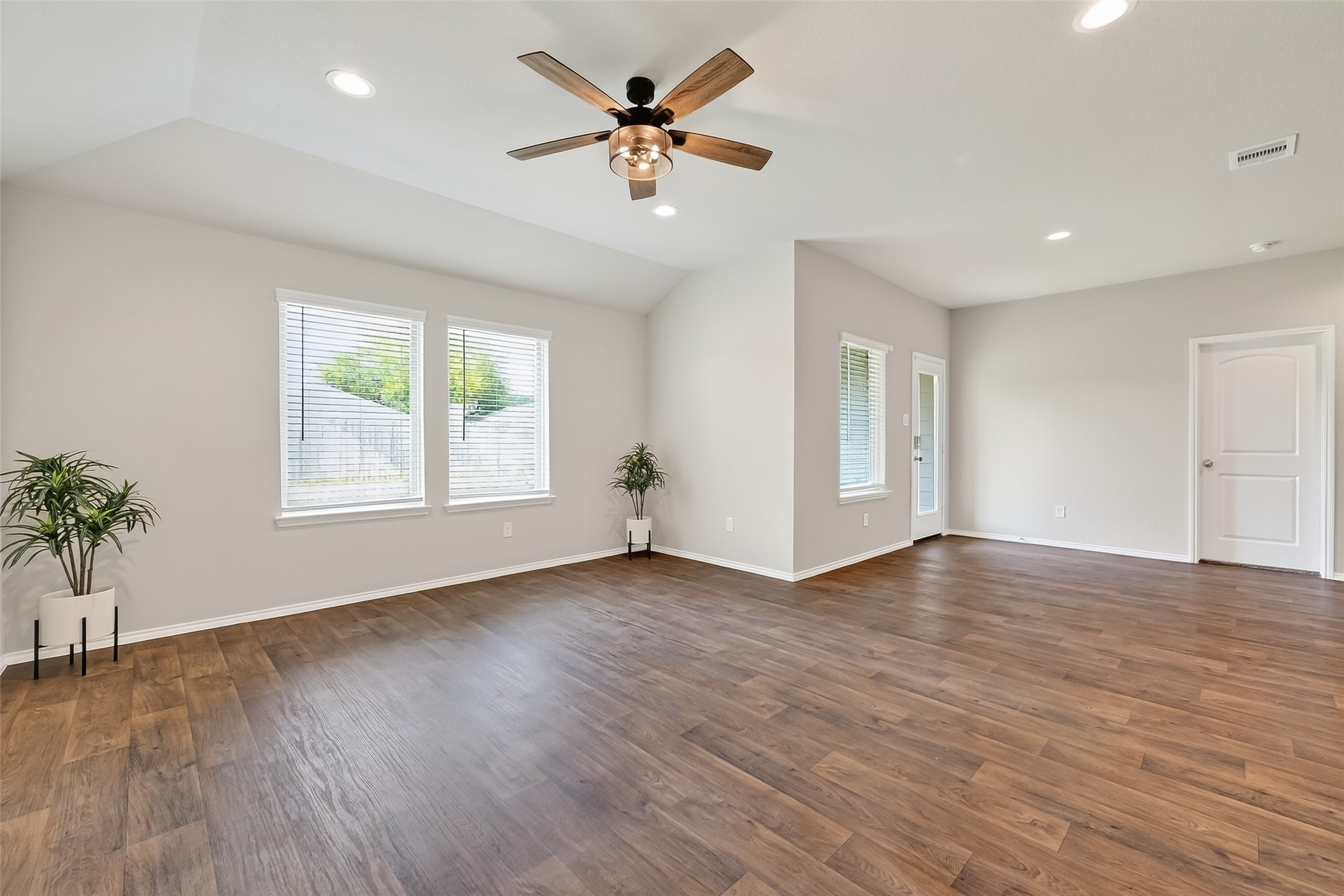23511 Treeline Bluff Trail Spring Spring, TX 77373 - Photo 8 of 41 a view of an empty room with window and wooden floor