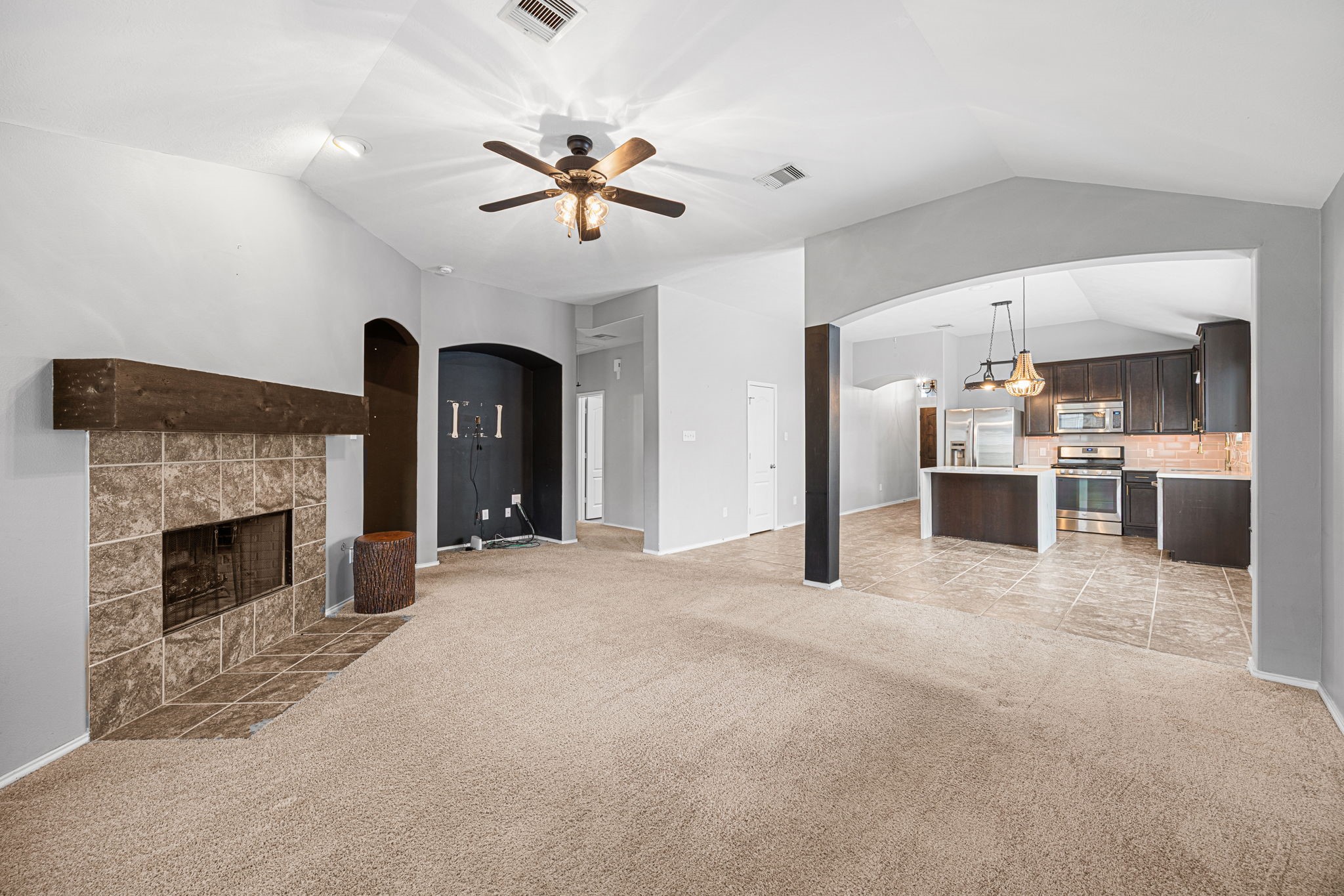2211 Oak Rise Drive Conroe, TX 77304 - Photo 4 of 29 Spacious living room with fireplace and ceiling fan
