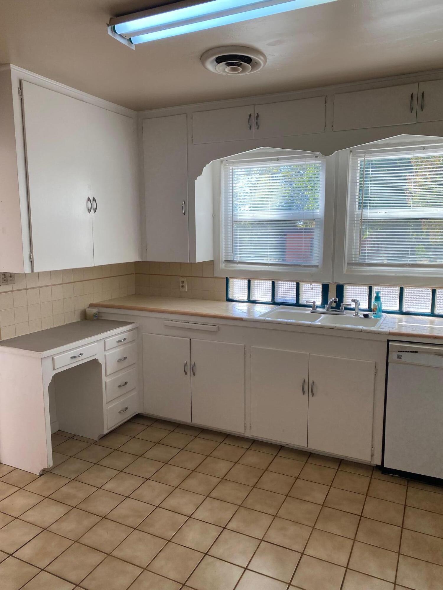 1410 Miller Way Red Bluff, CA 96080 - Photo 13 of 22 a kitchen with a sink and cabinets