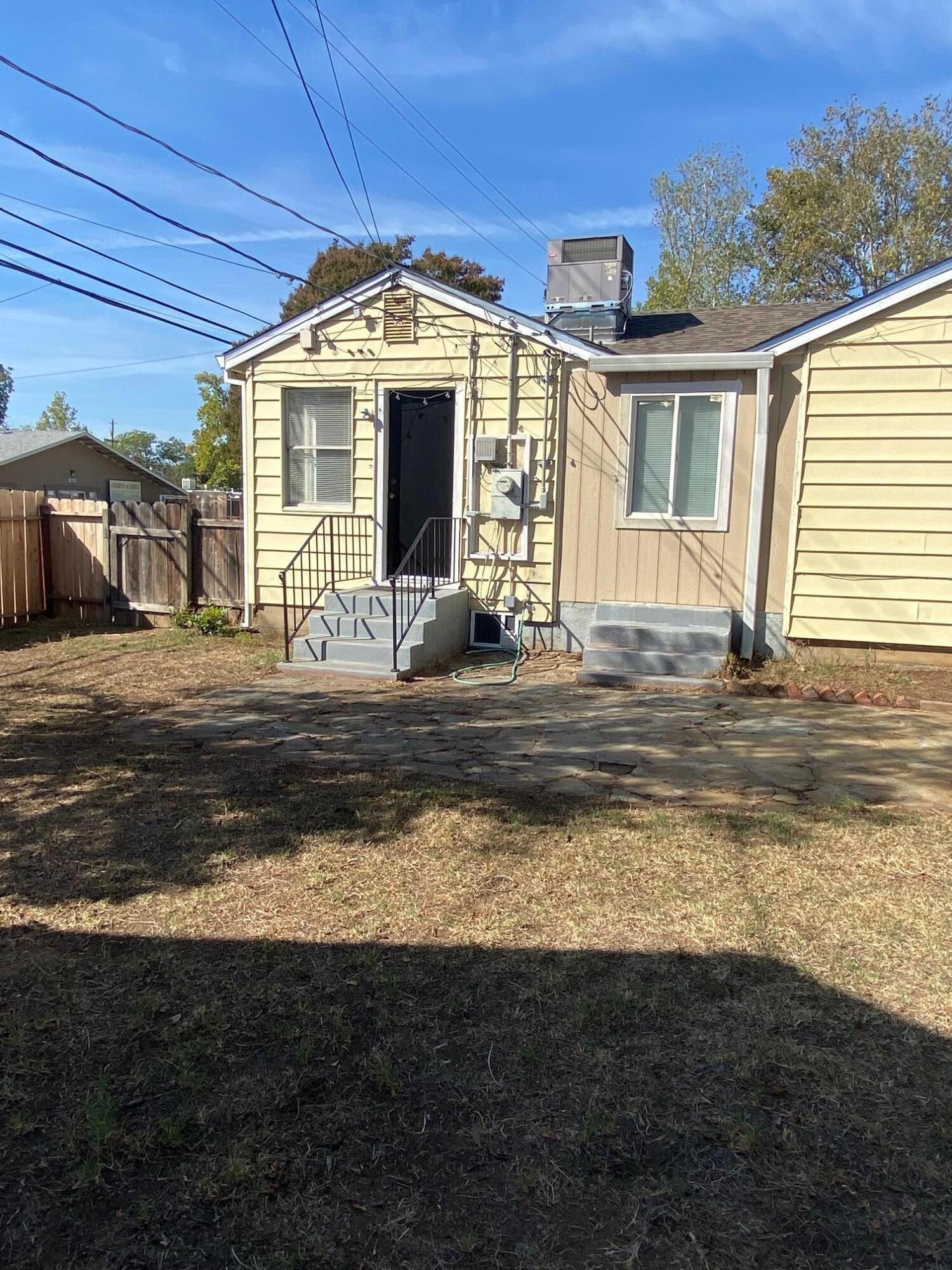 1410 Miller Way Red Bluff, CA 96080 - Photo 18 of 22 a front view of a house with a yard