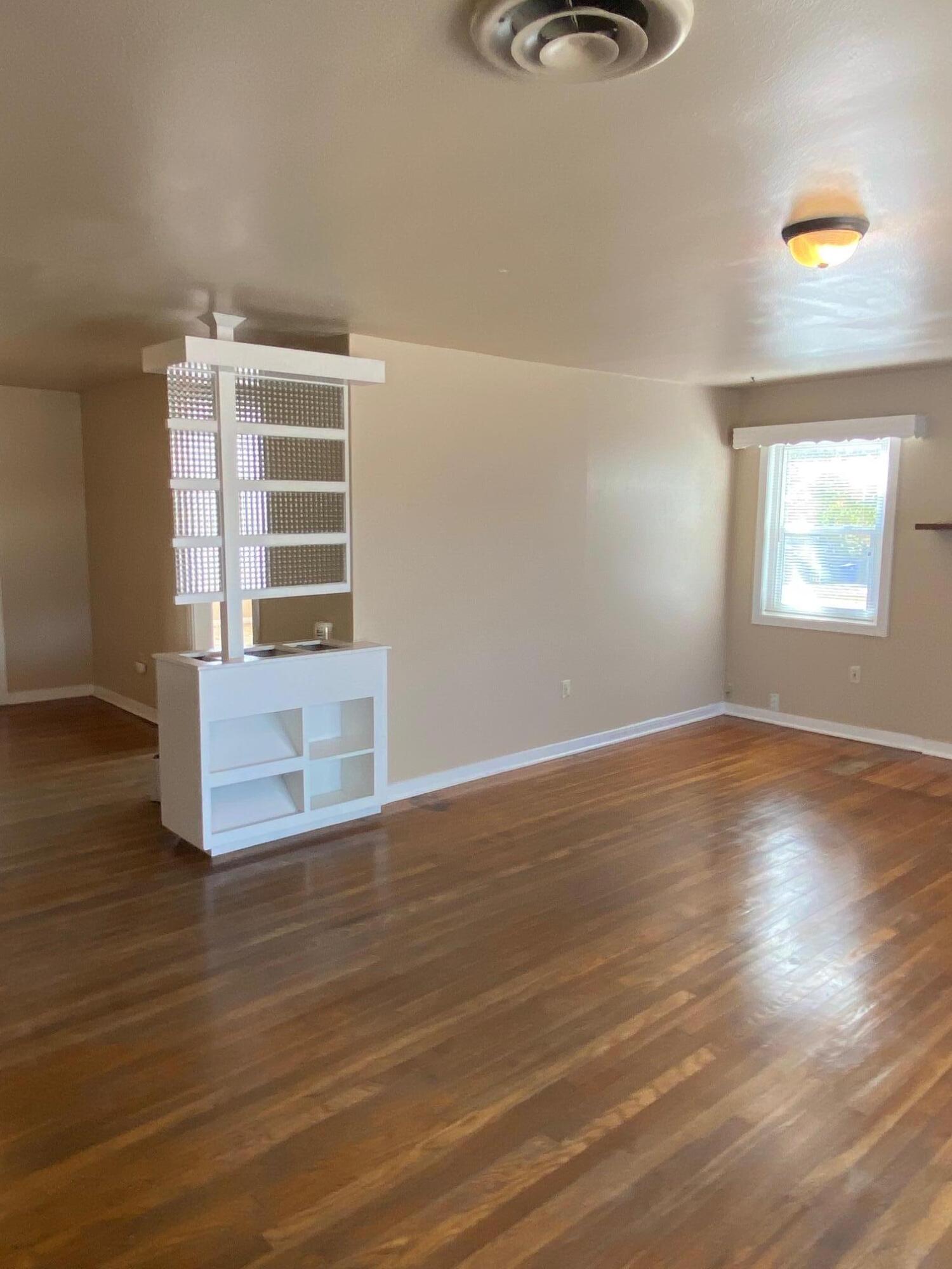 1410 Miller Way Red Bluff, CA 96080 - Photo 7 of 22 a view of a livingroom with wooden floor and a window