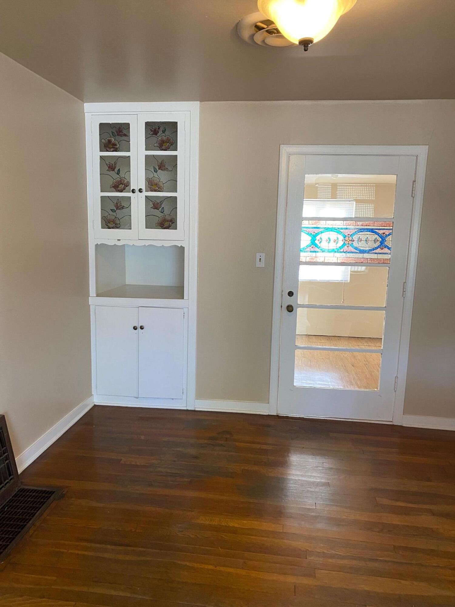 1410 Miller Way Red Bluff, CA 96080 - Photo 9 of 22 a view of empty room with wooden floor and fan