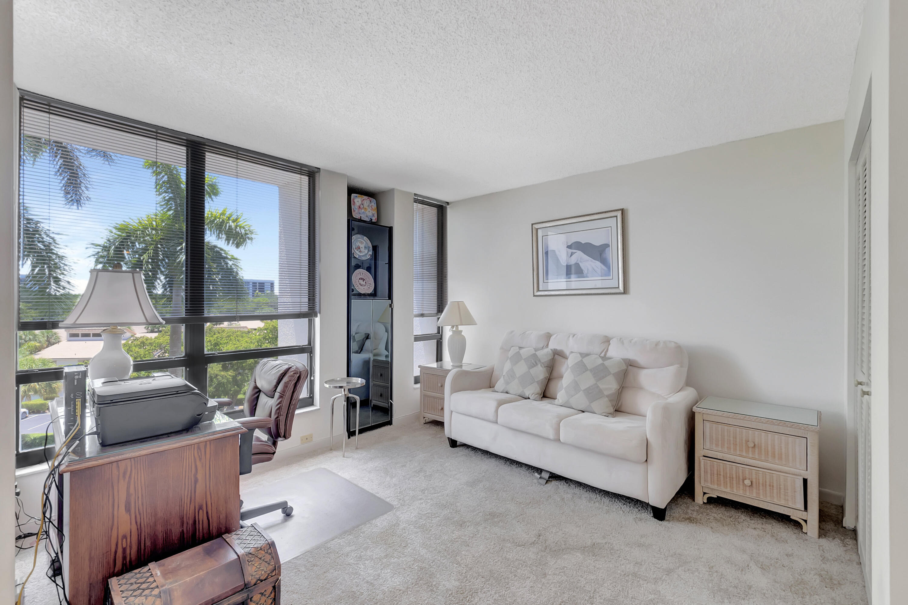 7738 Lakeside Boulevard, Unit 353 Boca Raton, FL 33434 - Photo 19 of 76 a living room with furniture and a large window