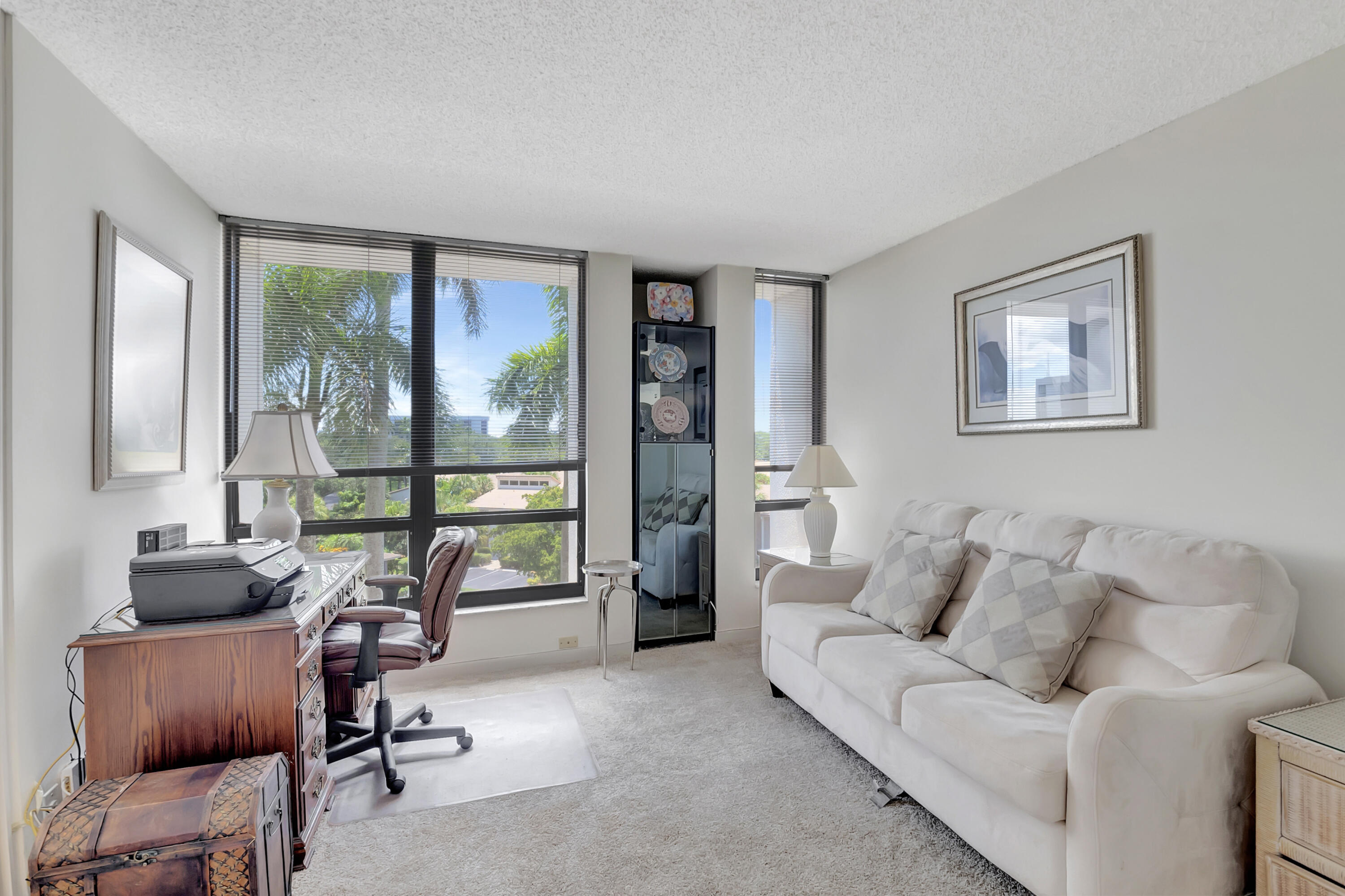 7738 Lakeside Boulevard, Unit 353 Boca Raton, FL 33434 - Photo 20 of 76 a living room with furniture and a floor to ceiling window