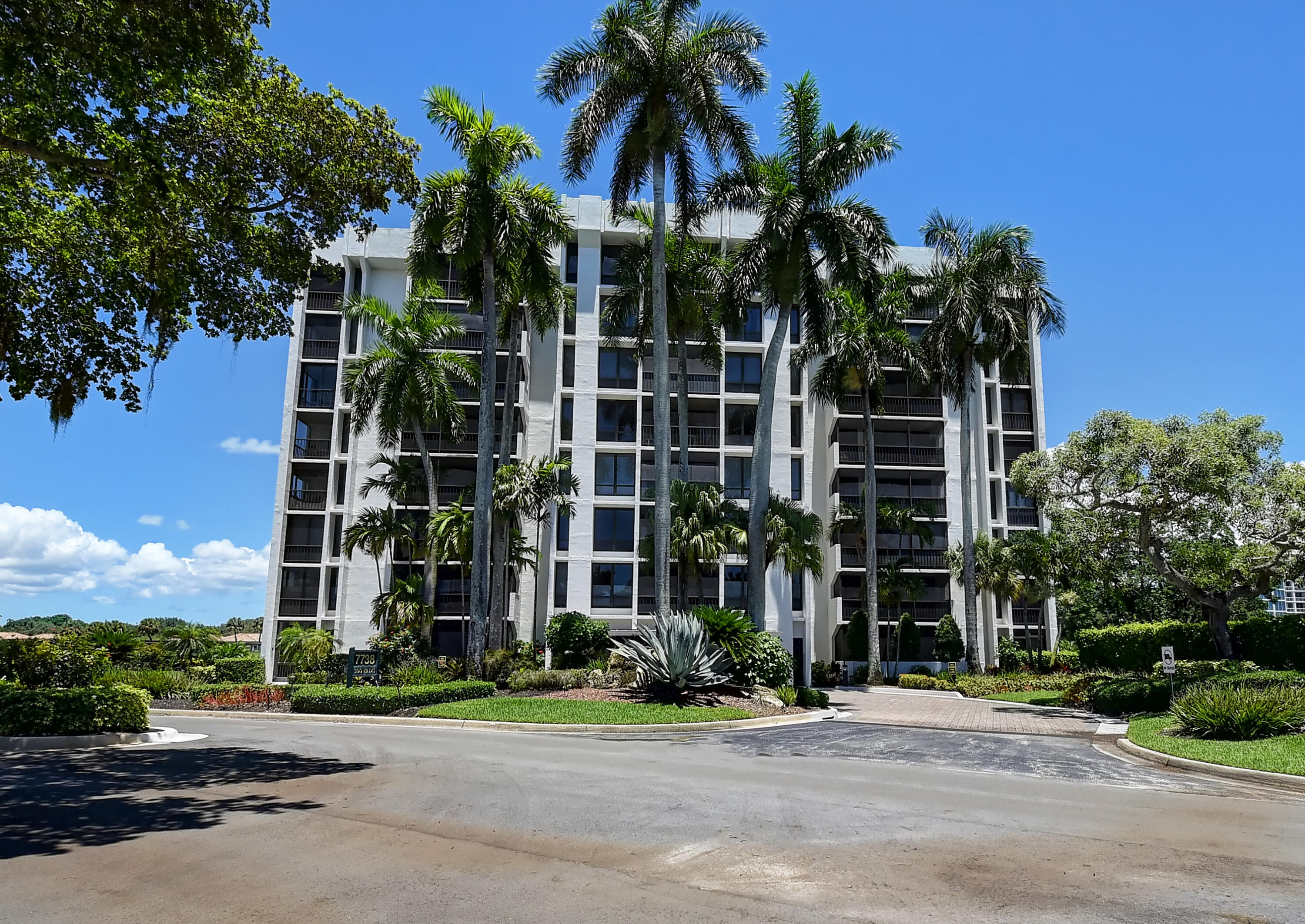 7738 Lakeside Boulevard, Unit 353 Boca Raton, FL 33434 - Photo 2 of 76 front view of a building with a street
