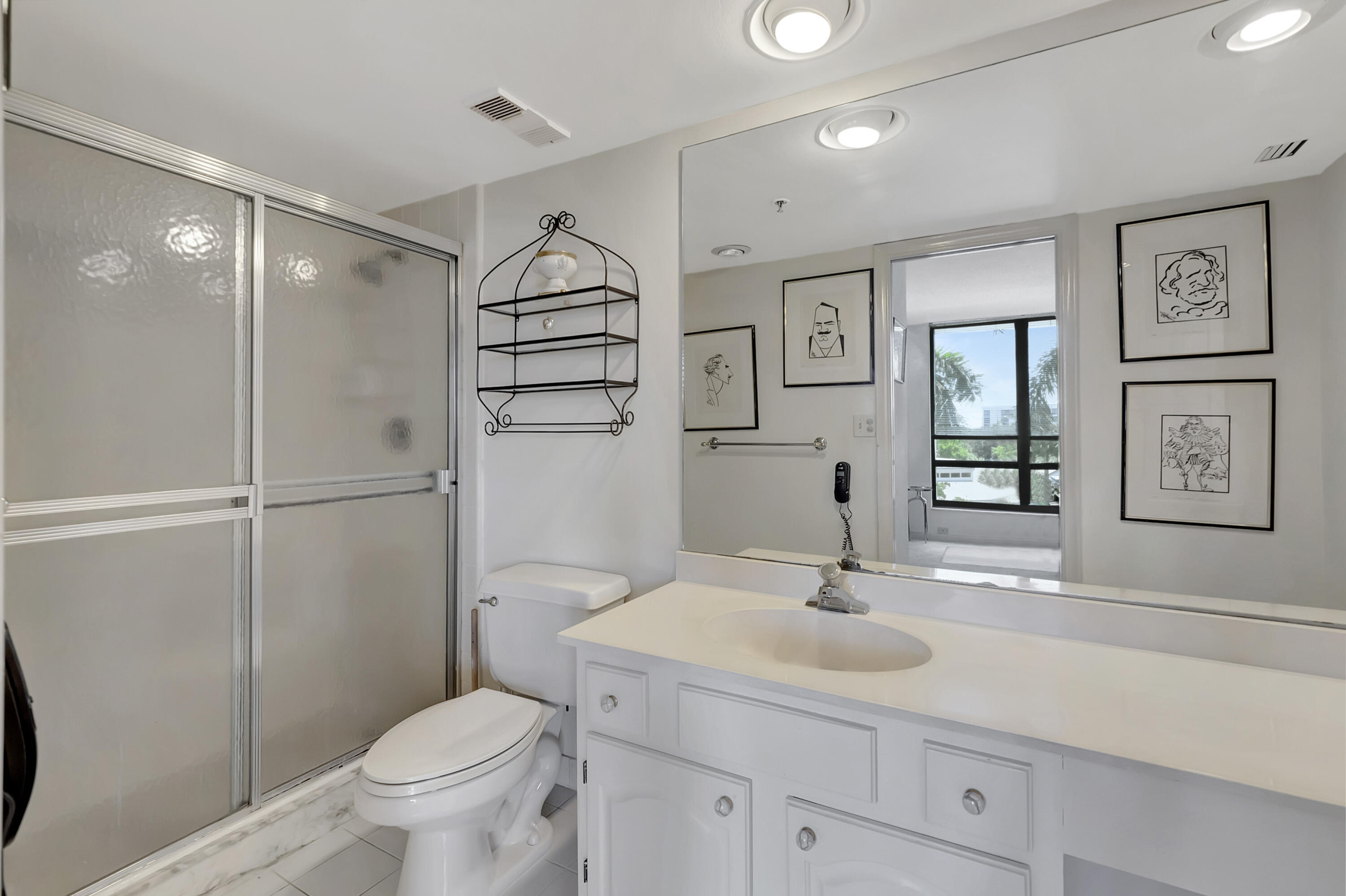 7738 Lakeside Boulevard, Unit 353 Boca Raton, FL 33434 - Photo 21 of 76 a bathroom with a sink toilet and shower