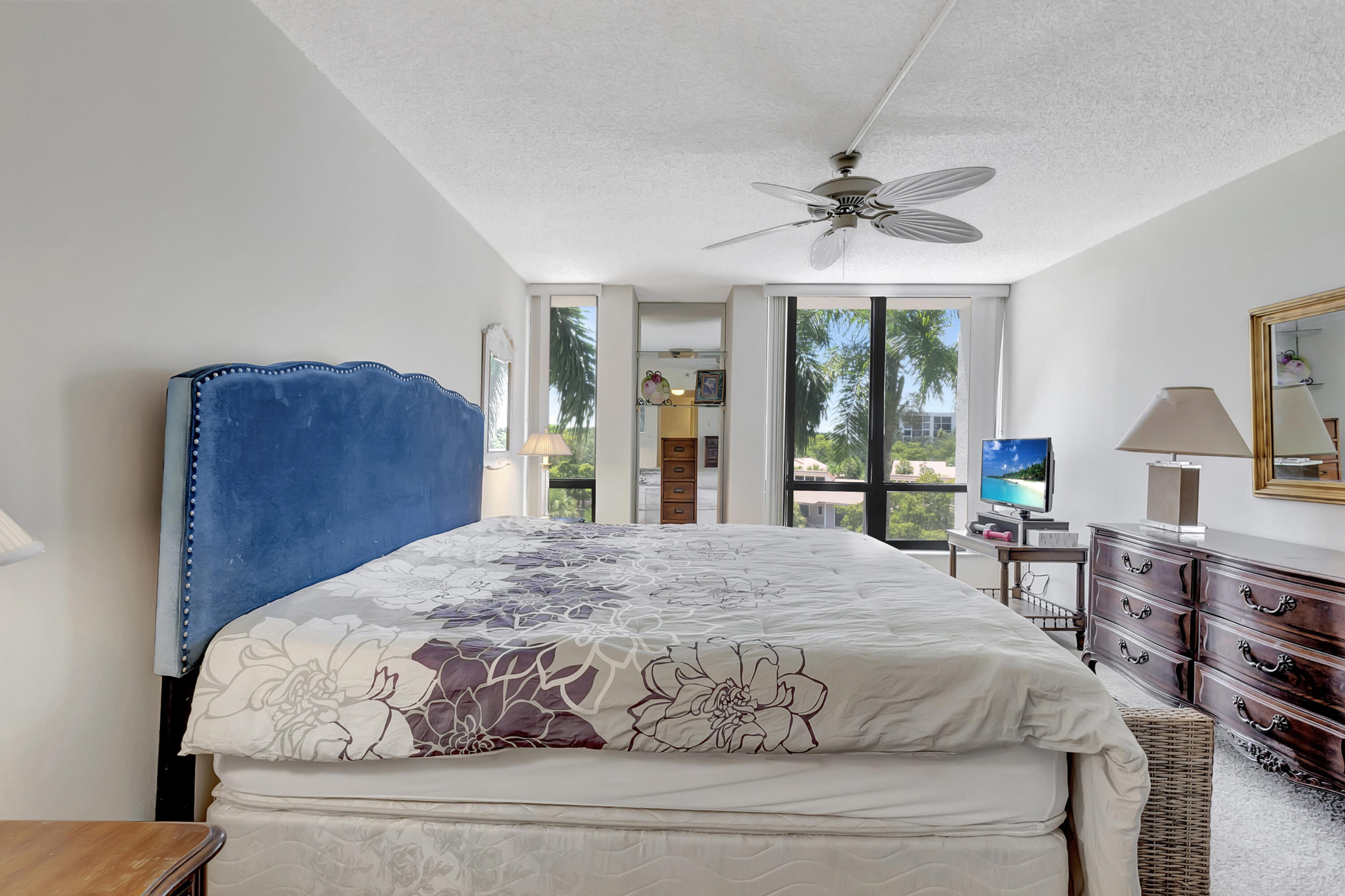 7738 Lakeside Boulevard, Unit 353 Boca Raton, FL 33434 - Photo 23 of 76 a bedroom with a large bed and a window