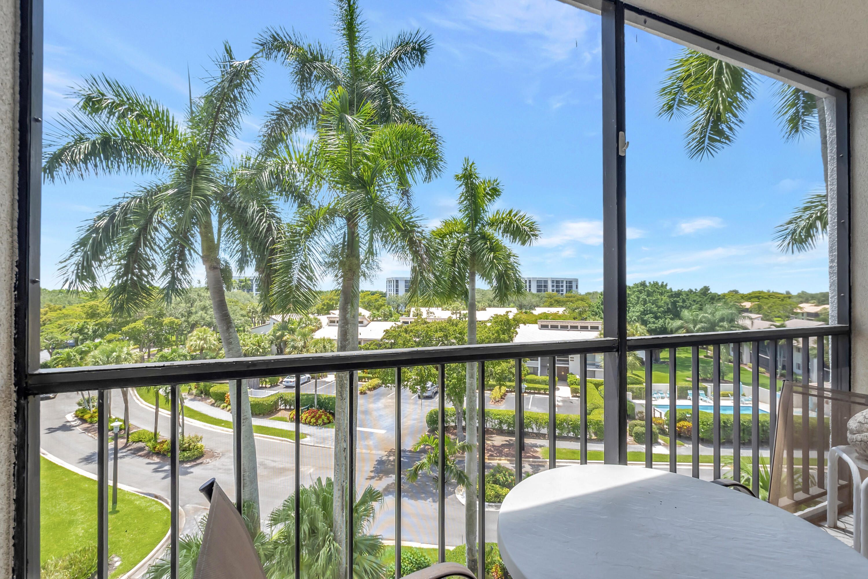 7738 Lakeside Boulevard, Unit 353 Boca Raton, FL 33434 - Photo 25 of 76 a view of a glass door and deck