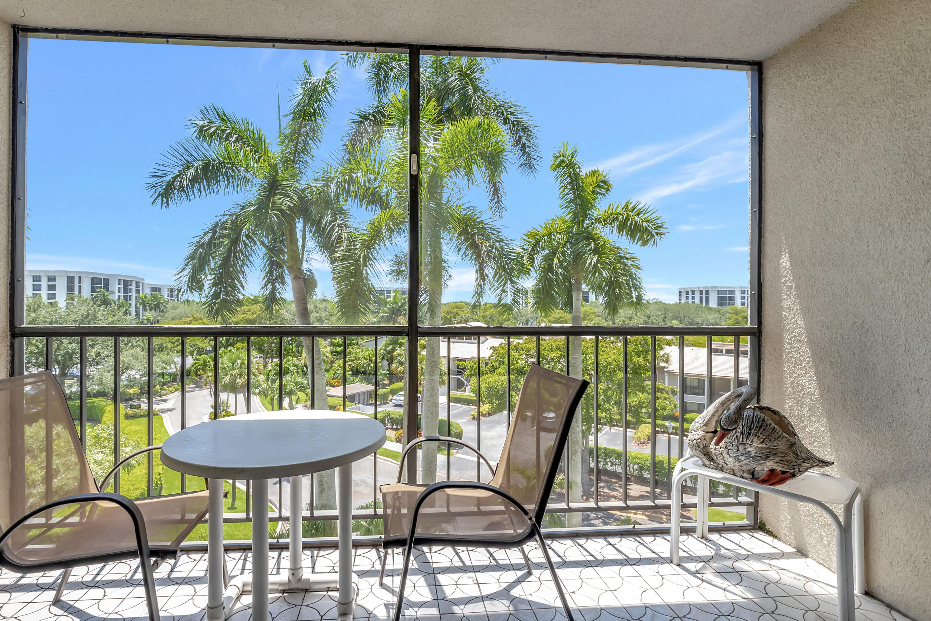 7738 Lakeside Boulevard, Unit 353 Boca Raton, FL 33434 - Photo 27 of 76 a view of a chairs and table in patio