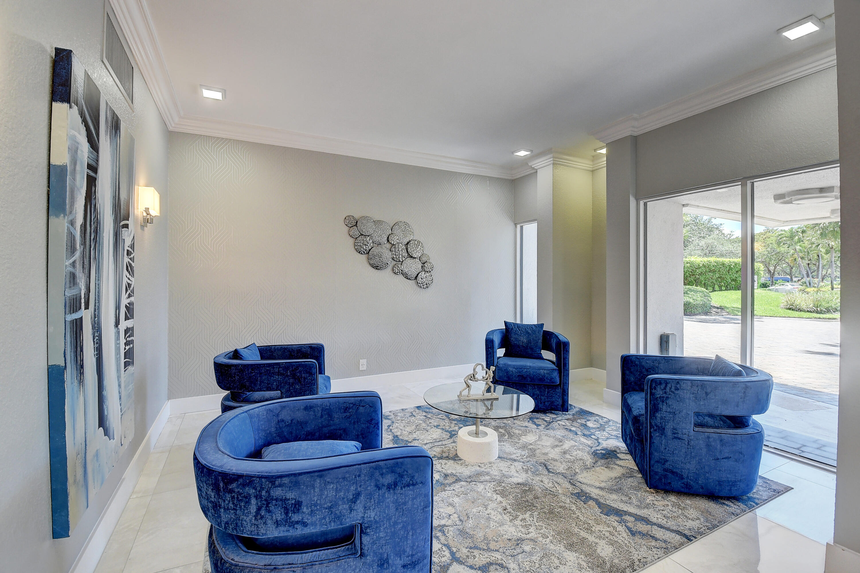 7738 Lakeside Boulevard, Unit 353 Boca Raton, FL 33434 - Photo 6 of 76 a living room with furniture and a large window