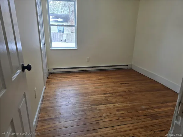 a view of a room with wooden floor and staircase