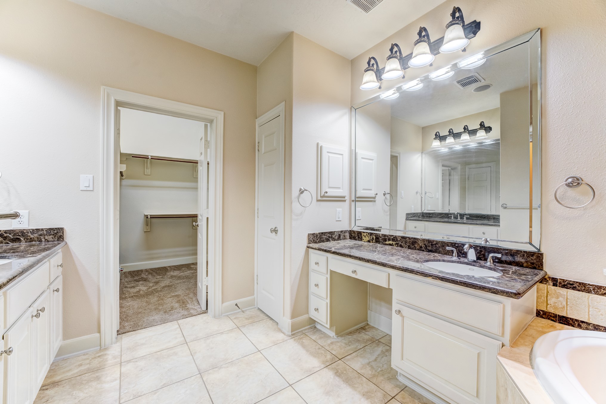 7938 Wooded Way Drive Spring, TX 77389 - Photo 15 of 49 This Primary bath also features a separate vanity areaand, His and Her vanities and Large walk in shower.