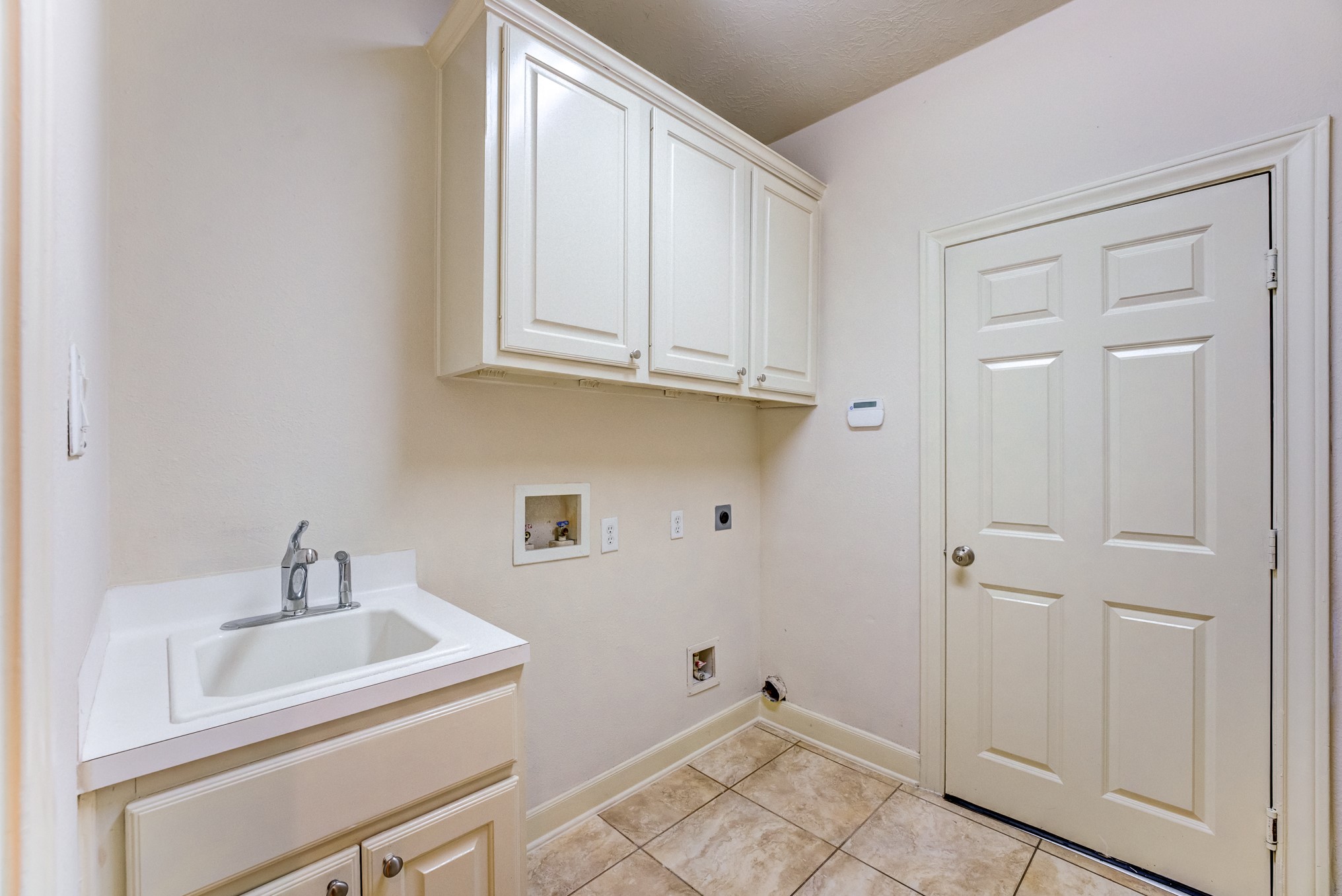 7938 Wooded Way Drive Spring, TX 77389 - Photo 30 of 49 Plenty of extra cabinets in Laundry room just outside the kitchen