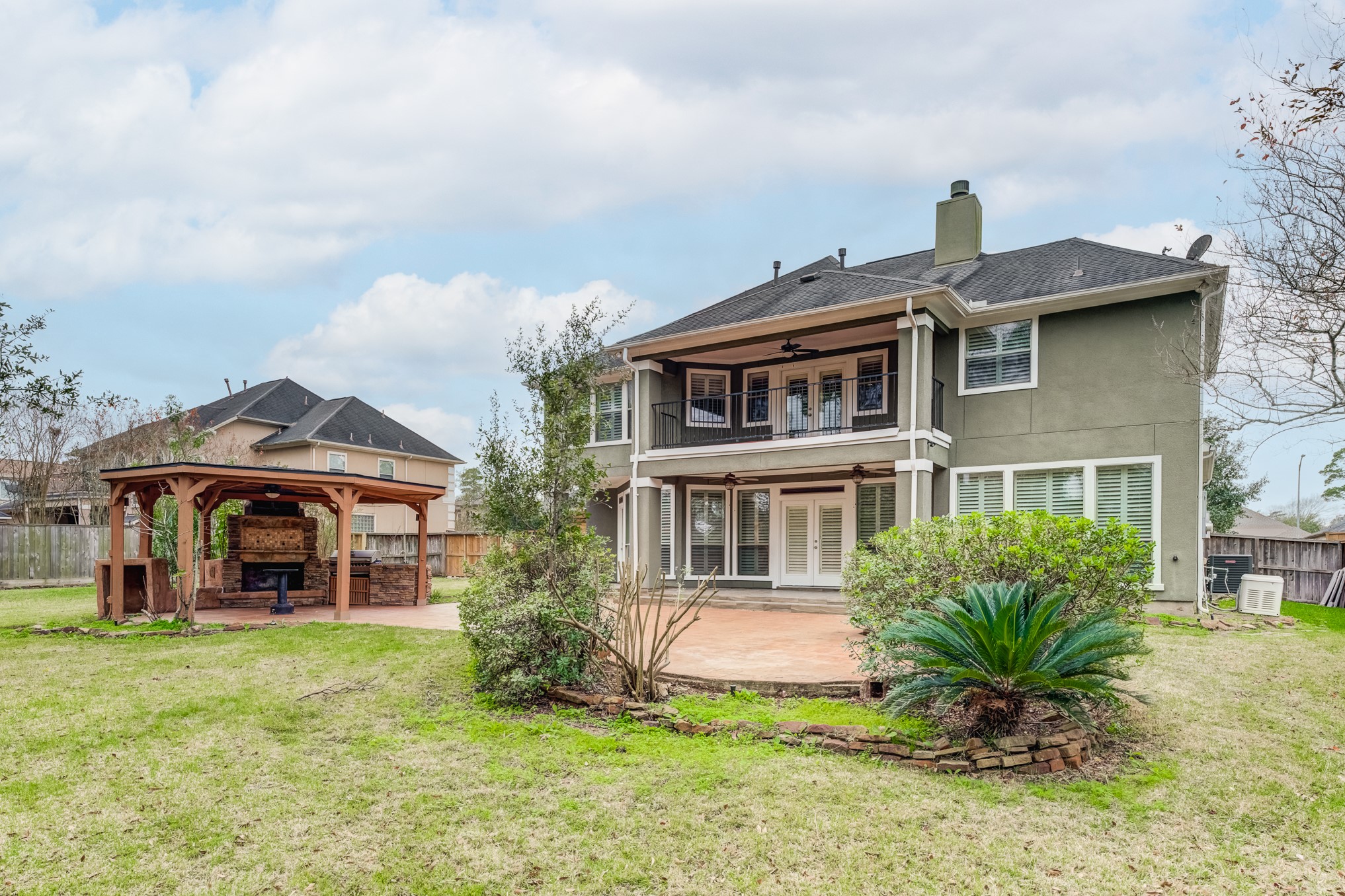 7938 Wooded Way Drive Spring, TX 77389 - Photo 33 of 49 Step outside to the covered patio for easy grilling.