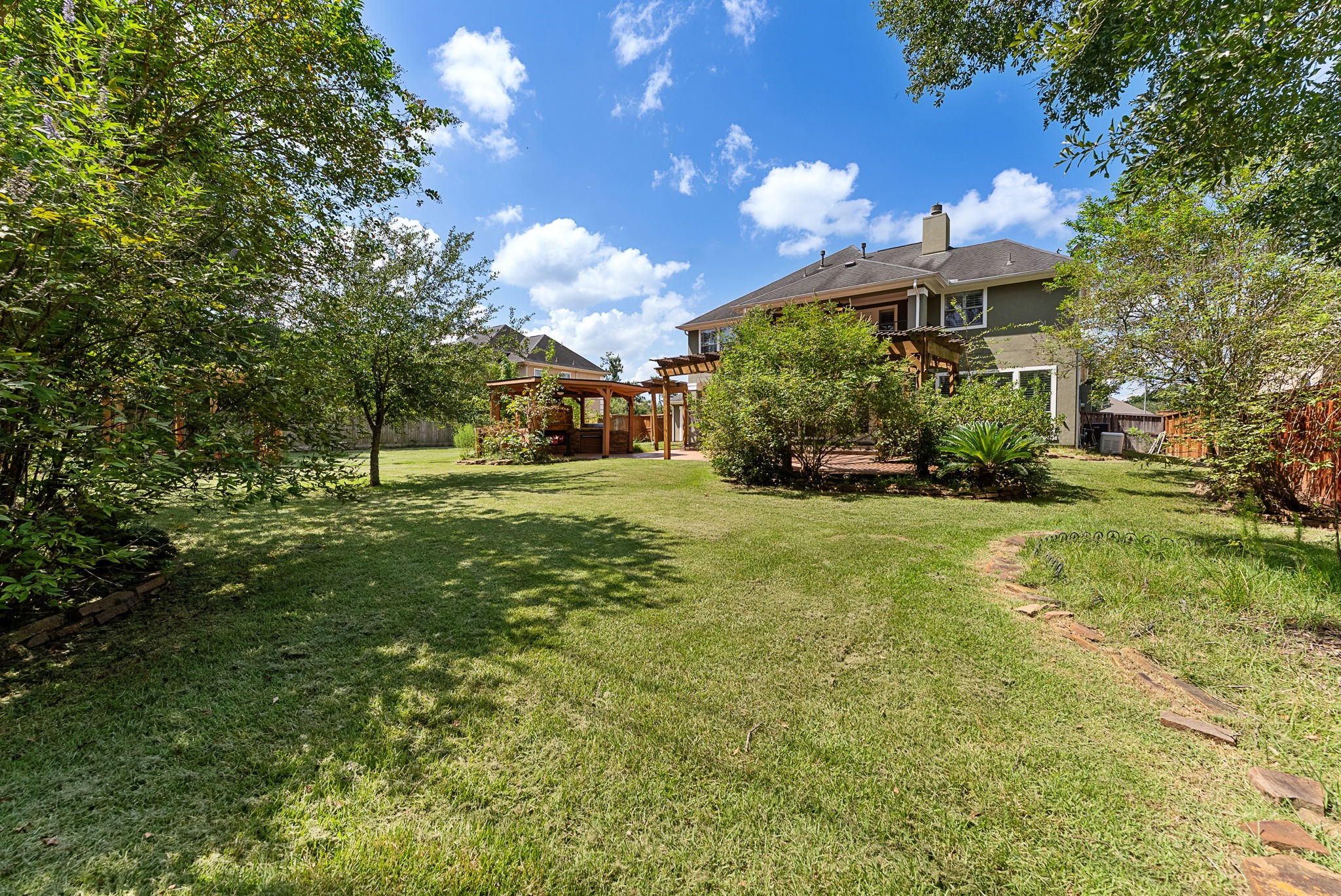 7938 Wooded Way Drive Spring, TX 77389 - Photo 39 of 49 Plenty of green space for running, playing and pets Plenty of room and great sunlight for vegetable gardening too This is a virtual picture showing the possibility of future pool Close