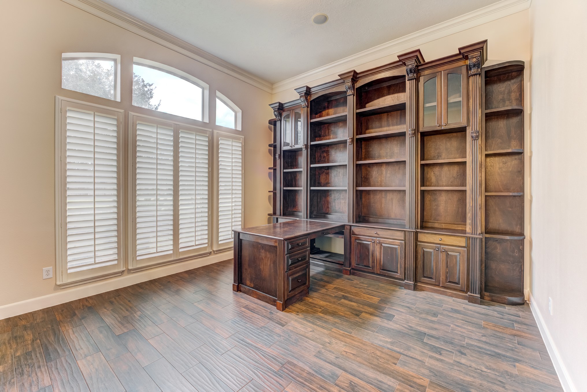 7938 Wooded Way Drive Spring, TX 77389 - Photo 4 of 49 The Study to the left of the foyer showcases gleaming wood floors.