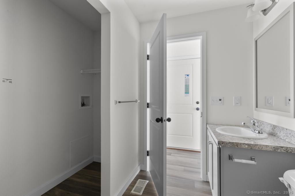 55 Sugar Street, Unit 4 Newtown, CT 06470 - Photo 11 of 22 a bathroom with a granite countertop sink