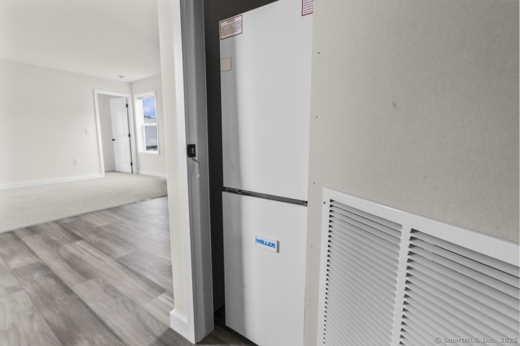 55 Sugar Street, Unit 4 Newtown, CT 06470 - Photo 8 of 22 a view of a hallway to rooms