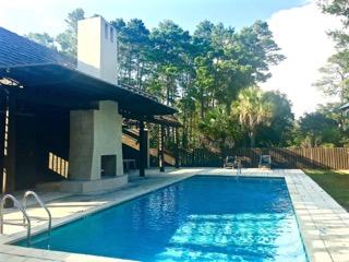 Lot 8 Pine Cone Trail Inlet Beach Inlet Beach, FL 32461 - Photo 1 of 5 a view of a swimming pool with a patio