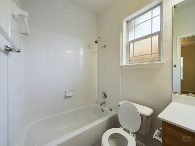 a bathroom with a bathtub toilet and sink
