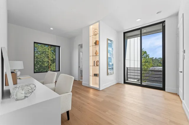 a bathroom with a tub a sink and a mirror