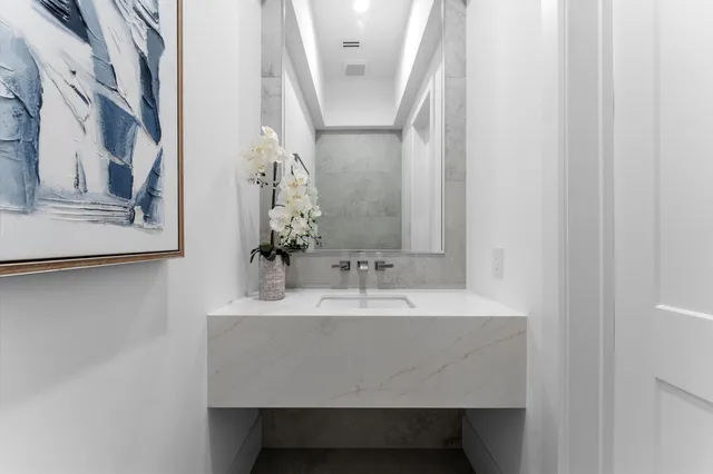 an empty room with windows and balcony