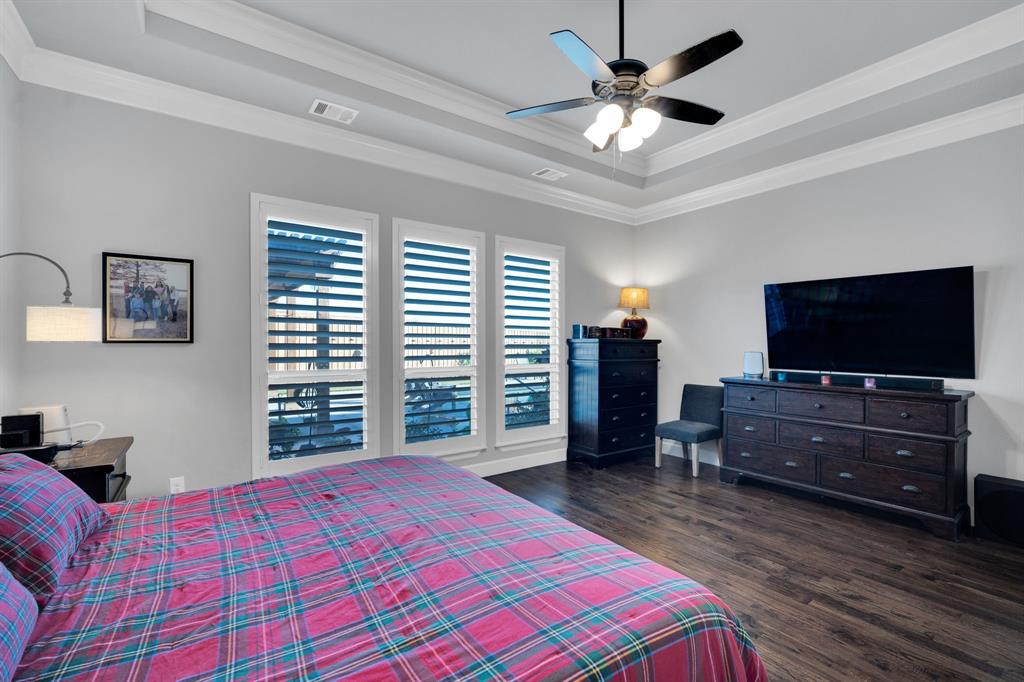 2501 Running Ranch Place Arlington, TX 76001 - Photo 17 of 38 a bedroom with a bed and a flat screen tv