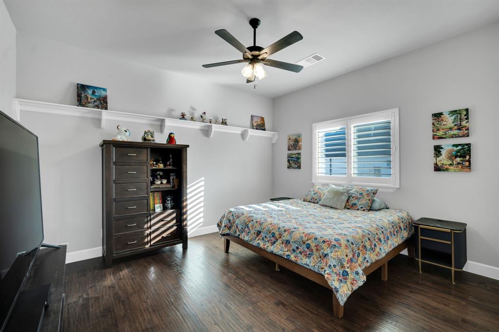2501 Running Ranch Place Arlington, TX 76001 - Photo 25 of 38 a bedroom with a bed and a ceiling fan