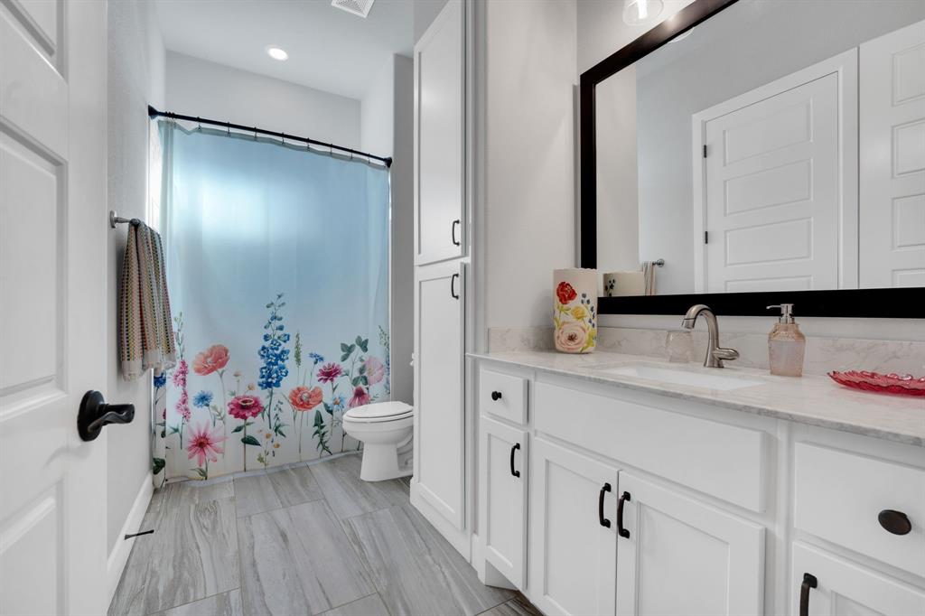 2501 Running Ranch Place Arlington, TX 76001 - Photo 26 of 38 a bathroom with a sink mirror and vanity