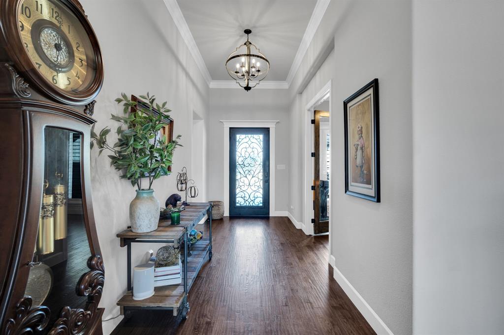 2501 Running Ranch Place Arlington, TX 76001 - Photo 32 of 38 a view of a hallway with furniture and a chandelier