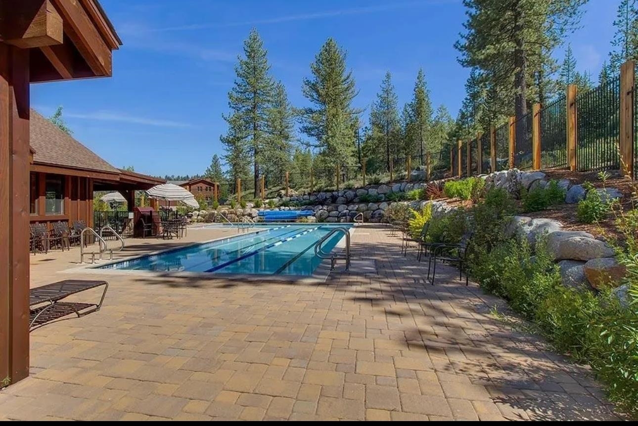 11612 Dolomite Way, Unit 4 Truckee, CA 96161 - Photo 14 of 16 a view of a backyard with swimming pool