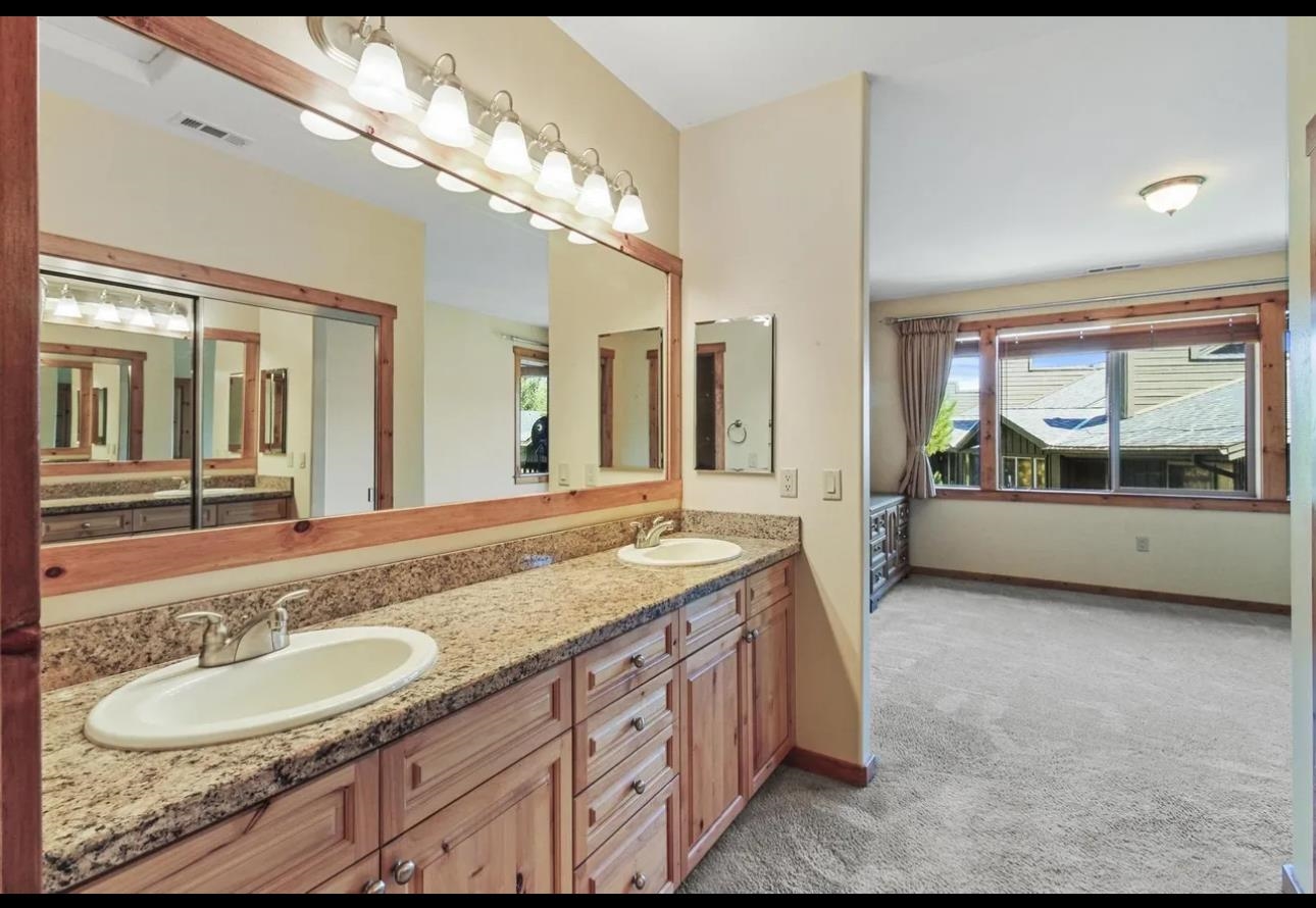 11612 Dolomite Way, Unit 4 Truckee, CA 96161 - Photo 6 of 16 a bathroom with a granite countertop double vanity and a large mirror