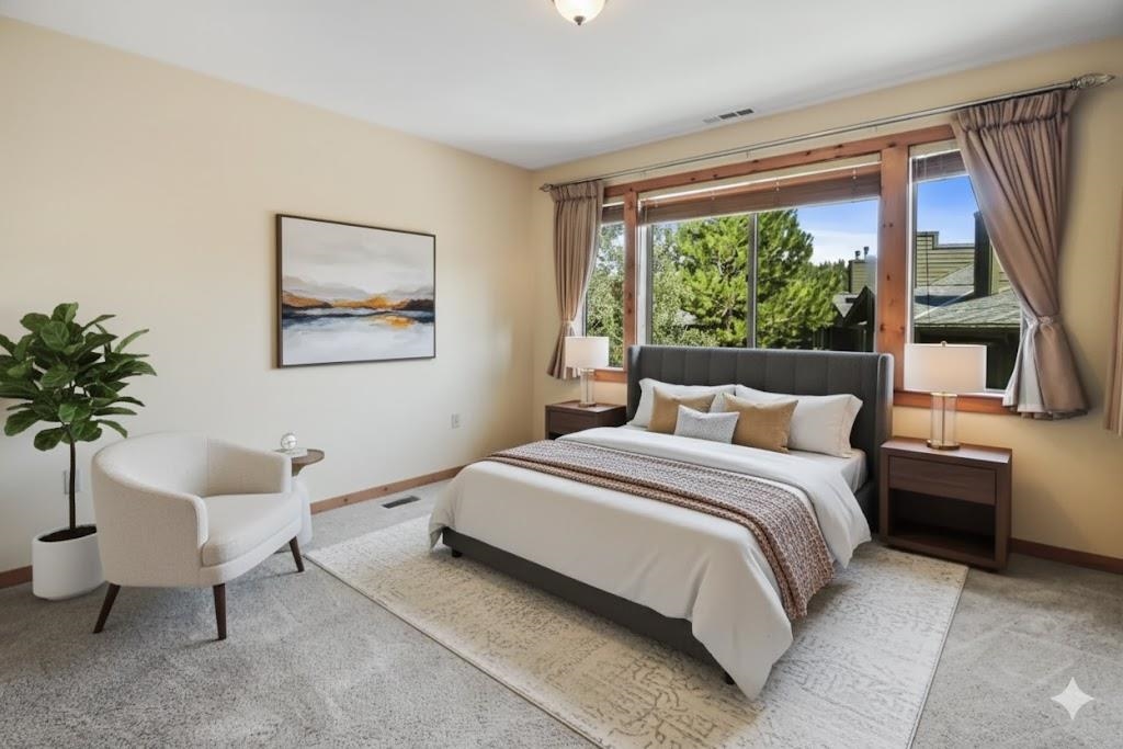 11612 Dolomite Way, Unit 4 Truckee, CA 96161 - Photo 9 of 16 a bedroom with a large bed and a potted plant