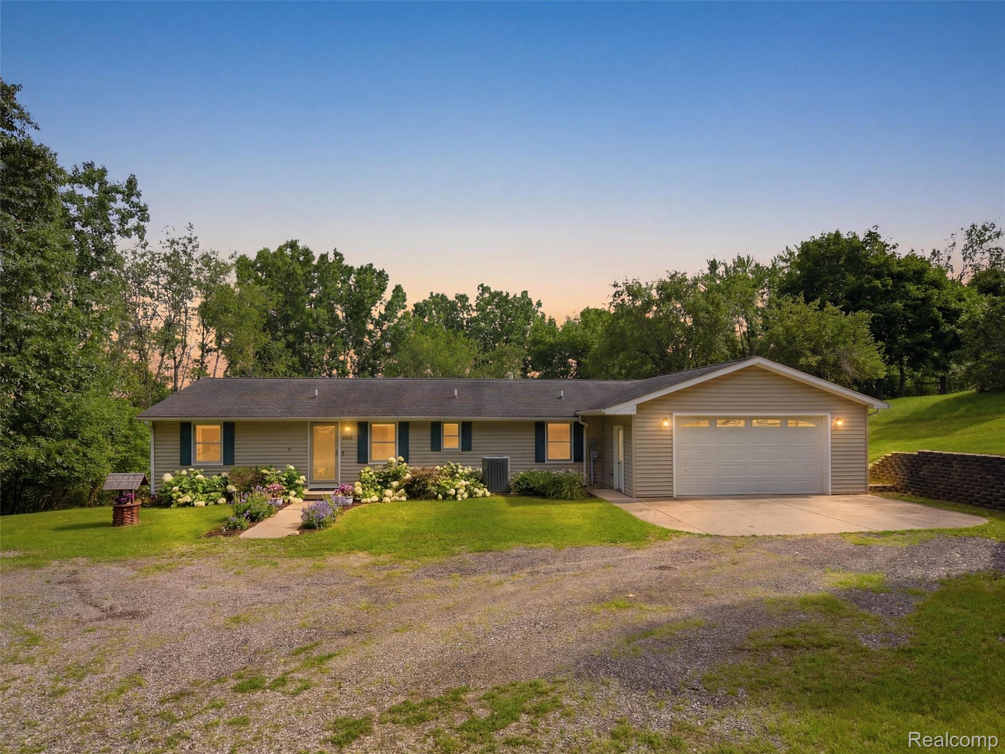 5003 Mason Road Howell, MI 48843 - Photo 1 of 59 Ranch-style residence featuring beige siding and dark window shutters