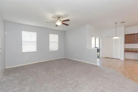 a view of a kitchen with a sink and cabinets