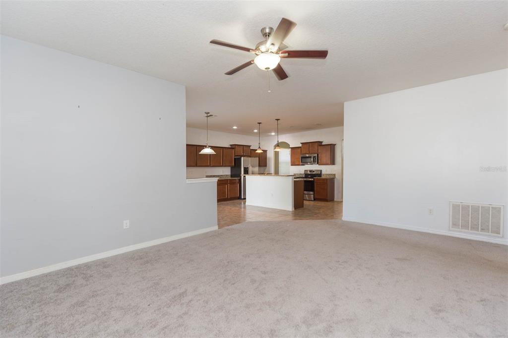 1803 Palm Warbler Lane Ruskin, FL 33570 - Photo 18 of 51 a view of a kitchen with a sink and cabinets