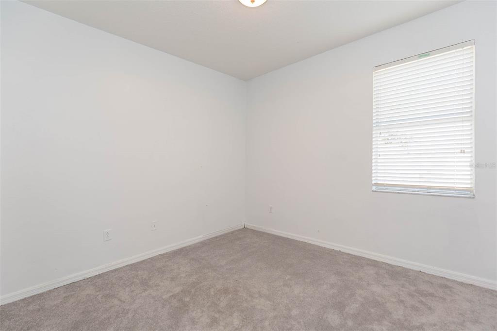 1803 Palm Warbler Lane Ruskin, FL 33570 - Photo 20 of 51 an empty room with a window