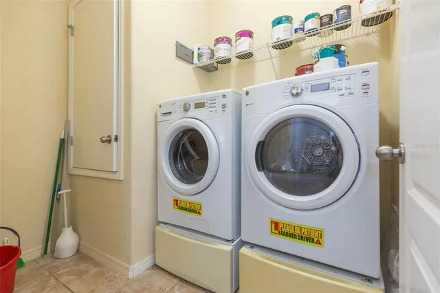 a utility room with dryer and washer