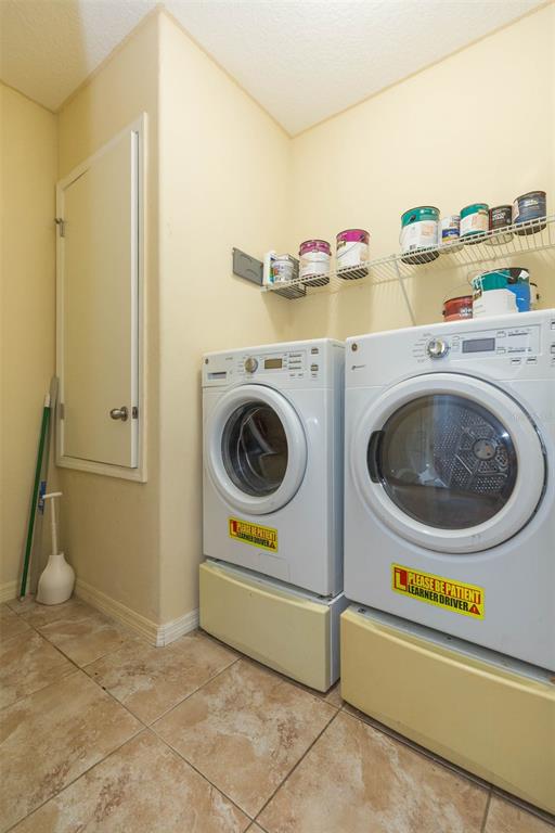 1803 Palm Warbler Lane Ruskin, FL 33570 - Photo 23 of 51 a utility room with dryer and washer