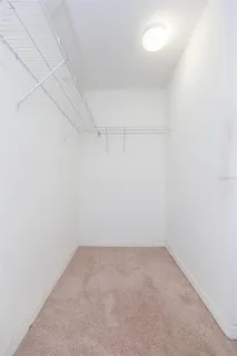 a bathroom with a granite countertop sink and mirror