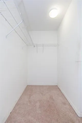 a bathroom with a granite countertop sink and mirror
