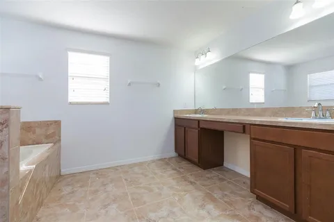 a view of a yard with large trees