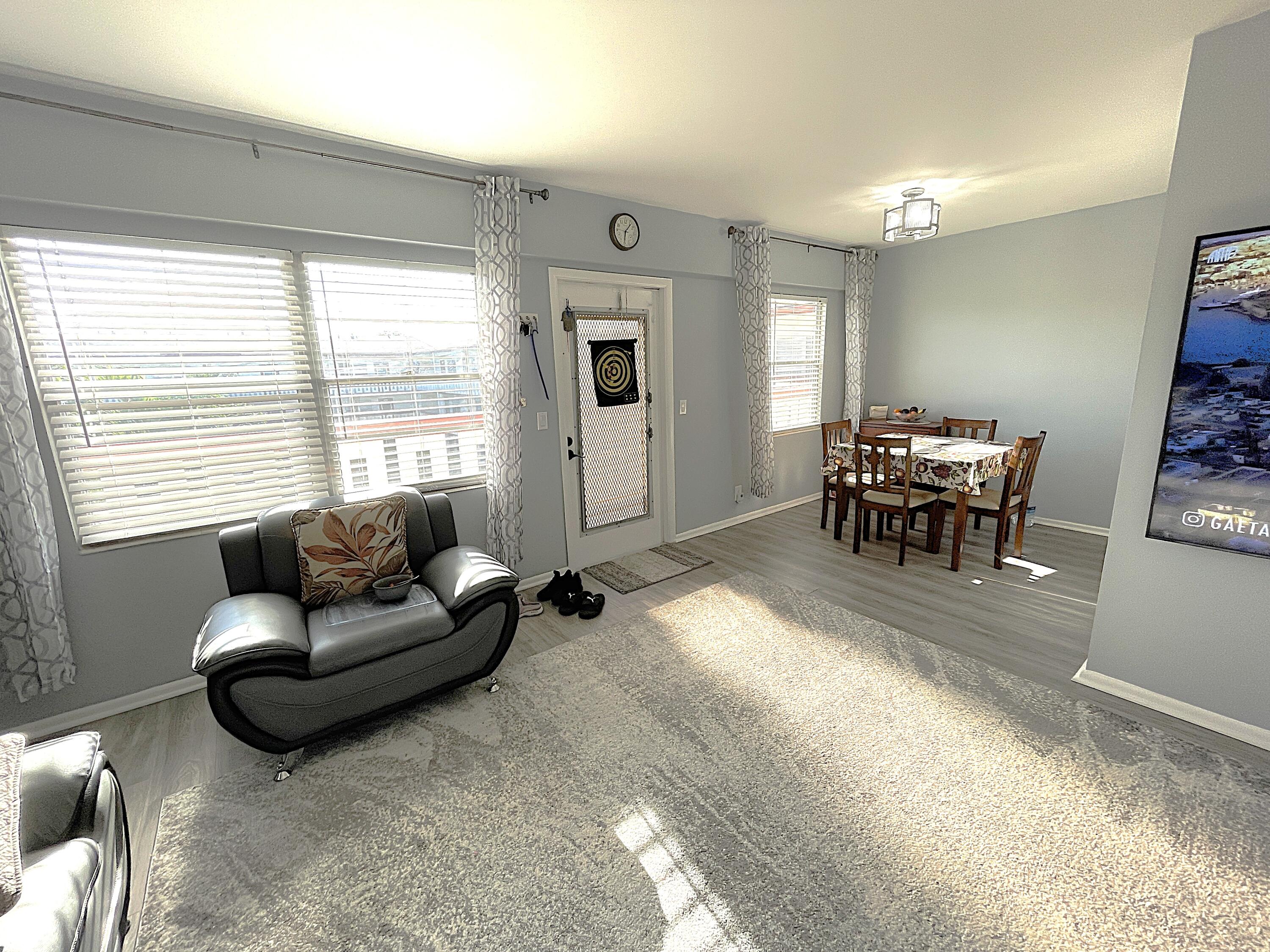 334 Brighton H Boca Raton, FL 33434 - Photo 3 of 23 Living Room to Dining Area