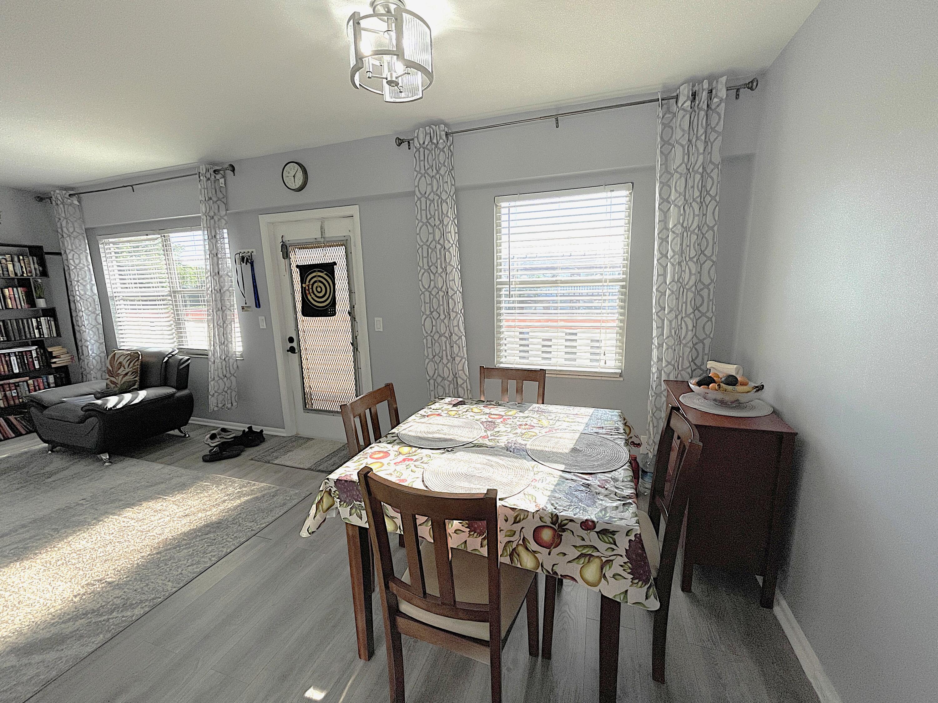 334 Brighton H Boca Raton, FL 33434 - Photo 4 of 23 Dining Area to Living Room